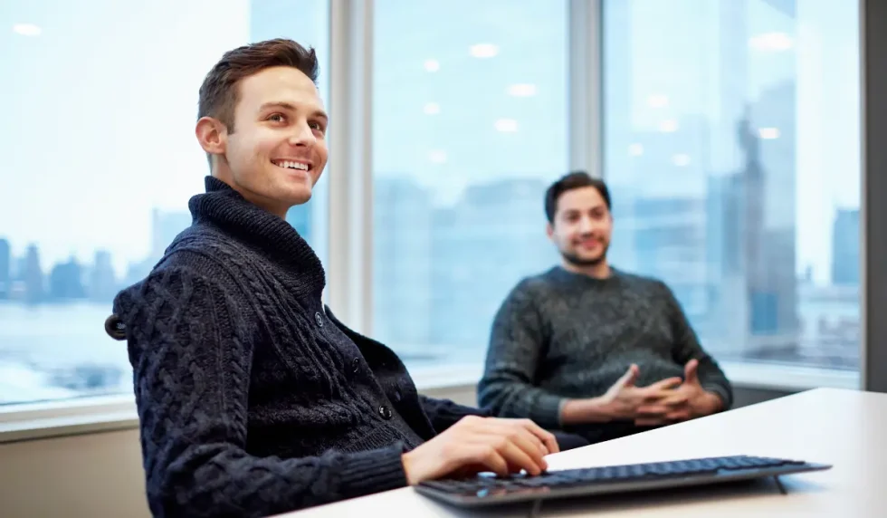 Two project managers in a meeting room